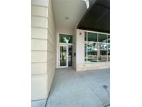Building entrance with large glass windows and modern architecture reflecting the outdoor scenery at 1500 State St # 401, Sarasota, FL 34236