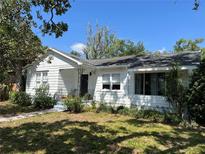 Charming single-story home with a well-maintained lawn, and a inviting porch with wrought iron accents at 4704 Winchester Dr, Sarasota, FL 34234