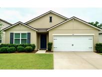 Charming single-story home featuring a well-maintained lawn and a two-car garage at 141 Tierra Verde Way, Bradenton, FL 34212