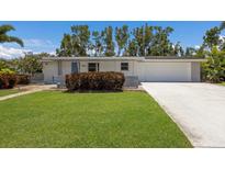 Charming one-story home featuring well-kept lawn and a two-car garage in a desirable location at 2560 Sunnyside St, Sarasota, FL 34239