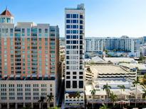 View of condo building exterior with tall windows and a prime downtown location at 33 S Palm Ave # 1602, Sarasota, FL 34236