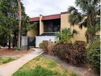 Inviting two-story condo with lush landscaping and a charming private balcony at 105 S Obrien St # 213, Tampa, FL 33609
