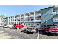 Three-story condominium building featuring parking and balconies for each unit at 1819 Restful Dr # N25, Bradenton, FL 34207