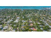 Expansive aerial view showcasing the neighborhood, with a glimpse of the bay in the background at 1931 Bahia Vista St, Sarasota, FL 34239