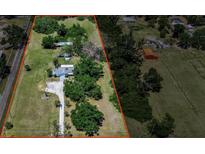 Spacious property featuring a home, outbuildings and mature trees at 2040 Edmondson Rd, Nokomis, FL 34275