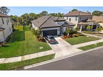 Beautiful one-story home featuring a well-manicured lawn and attached two-car garage at 224 Caserta Ct, Nokomis, FL 34275