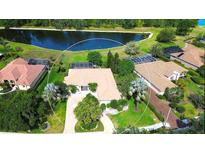 Beautiful aerial view of home with mature landscaping and a pond view at 3201 Wilderness W Blvd, Parrish, FL 34219