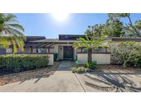 Inviting front entrance with stone accents and a well-manicured lawn, creating a welcoming curb appeal at 3608 Avenida Madera, Bradenton, FL 34210