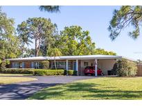 Charming single-story home with a well-manicured lawn and inviting curb appeal at 91 39Th Street Nw Ct, Bradenton, FL 34205