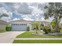 Charming single-story home with a well-manicured lawn and lovely curb appeal at 12026 Warwick Cir, Parrish, FL 34219
