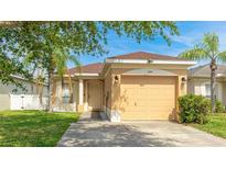 Charming single-story home with a well-maintained lawn and attached two-car garage at 2344 28Th E Ave, Palmetto, FL 34221