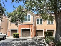 Charming multi-story townhome featuring a private garage and well-maintained landscaping at 4122 Central Sarasota Pkwy # 1923, Sarasota, FL 34238