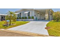 Charming single-story home with a well-maintained lawn and cozy carport at 4519 14Th E St, Ellenton, FL 34222