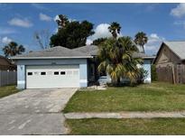 Charming single-story home with well-maintained lawn and a two car garage at 6928 43Rd E Ct, Sarasota, FL 34243