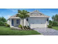 Charming single-story home with a two-car garage, a well-manicured lawn, and beautiful landscaping at 9165 Florida Rock Trl, Sarasota, FL 34240