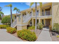Inviting two-story condo building with well-manicured landscaping and charming exterior design at 5633 Key Largo Ct # B-08, Bradenton, FL 34203