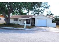 Well-maintained single-Gathering home featuring an attached garage at 9835 El Camino Real Ave, Port Richey, FL 34668