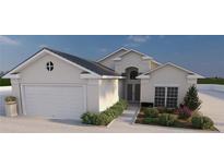 Charming single Gathering home boasting a two-car garage, manicured landscaping, and neutral exterior paint at 12535 Estrella Blvd, Punta Gorda, FL 33955