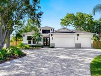 Beautiful two-story home with a three car garage and a paver driveway at 2246 Webber St, Sarasota, FL 34239