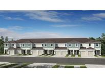 Charming townhome with a two-car garage, beautiful landscaping, and a well-maintained exterior at 15149 Cuzcorro Ct, Nokomis, FL 34275