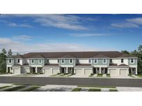 Beautiful townhome row with neutral paint and garage doors under a blue sky at 15177 Cuzcorro Ct, Nokomis, FL 34275