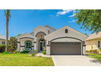 Beautiful single-Gathering home with a well-maintained lawn and attached two-car garage at 11116 Sanctuary Dr, Bradenton, FL 34209