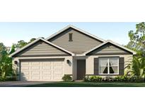 Charming one-story home featuring a two-car garage, well-manicured lawn, and inviting front entrance at 4319 112Th E St, Palmetto, FL 34221