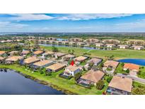 Beautiful aerial view of a home with pool in a golf community with lake views at 8603 River Preserve Dr, Bradenton, FL 34212