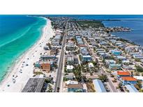 Stunning aerial view of a home near the beach with turquoise water, showcasing the ideal coastal living at 101 25Th N St # 1, Bradenton Beach, FL 34217