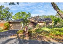 Charming single-story home with a well-maintained yard and attached two-car garage at 1502 Water Oak S Way, Bradenton, FL 34209