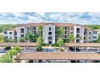 Beautiful condo building with lush landscaping and covered parking at 17118 Vardon Ter # 304, Bradenton, FL 34211