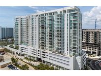 Stunning high-rise condo building with modern architectural design and ample balconies at 301 Quay Commons # 1709, Sarasota, FL 34236
