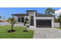 Stunning exterior of a modern home with manicured lawn and paver driveway at 532 Yale Rd, Venice, FL 34293