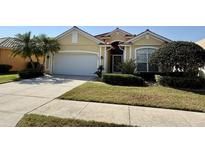 Charming single-story home boasts a well-manicured lawn, two-car garage and a beautiful tile roof at 1620 San Silvestro Dr, Venice, FL 34285