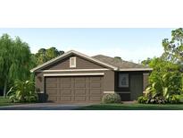 Charming single-story home with a well-maintained lawn and a two car garage at 5030 Rocky Coast Pl, Palmetto, FL 34221