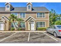 Inviting townhouse with well-maintained landscaping and convenient parking in front at 5531 Rosehill Rd # 204, Sarasota, FL 34233