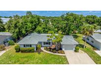 Charming single-story home with a well-manicured lawn and a freshly painted exterior at 6529 Seagate Ave, Sarasota, FL 34231