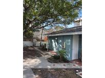 Quaint exterior view featuring a charming walkway and verdant foliage at 170 Roosevelt Dr # 5, Sarasota, FL 34236