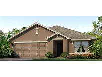 Charming single-story home with a two-car garage, landscaped front yard, and attractive curb appeal at 4517 Dusky Dawn Ln, Palmetto, FL 34221