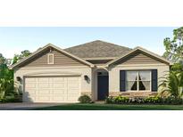 Charming one-story home featuring beige siding, a two-car garage, and a well-manicured front lawn at 18219 Wheathouse Pl, Lakewood Ranch, FL 34211
