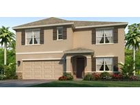 Charming two-story home with a well-manicured lawn, two car garage, and neutral color scheme at 18223 Canopy Pl, Lakewood Ranch, FL 34211