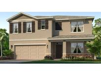 Inviting two-story home with a neutral color palette, a two-car garage and a well manicured lawn at 18227 Wheathouse Pl, Lakewood Ranch, FL 34211