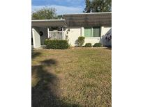 Charming home exterior featuring well-maintained landscaping and a welcoming front porch at 3921 Lakeside Rd # 168, Sarasota, FL 34232