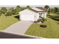 Charming single-story home with a well-manicured lawn and attached two-car garage at 13104 Bayberry Way, Parrish, FL 34219
