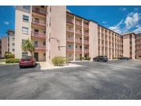 Condo complex with assigned parking spaces and balconies at 4015 Lake Bayshore Dr # 108, Bradenton, FL 34205