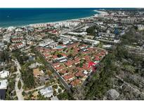 Incredible aerial view of a residential community with stunning ocean views and easy access to the beach at 151 Vista Hermosa Cir # 31C, Sarasota, FL 34242