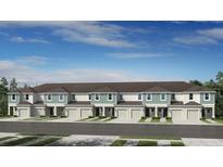 New townhome featuring a two-story exterior and attached garages at 15156 Cuzcorro Ct, Nokomis, FL 34275