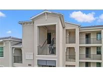 A close exterior view of an upscale condo featuring private entry staircases at 18114 Gawthrop Dr # 402, Bradenton, FL 34211
