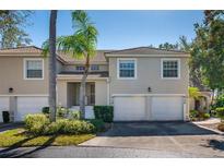 Charming townhome with attached garages, manicured landscaping, and a tile roof at 6748 Fairview Ter # 4-202, Bradenton, FL 34203