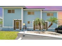 Charming condo with a private entrance and tropical landscaping, including palm trees at 1424 Mediterranean Dr # 112, Punta Gorda, FL 33950